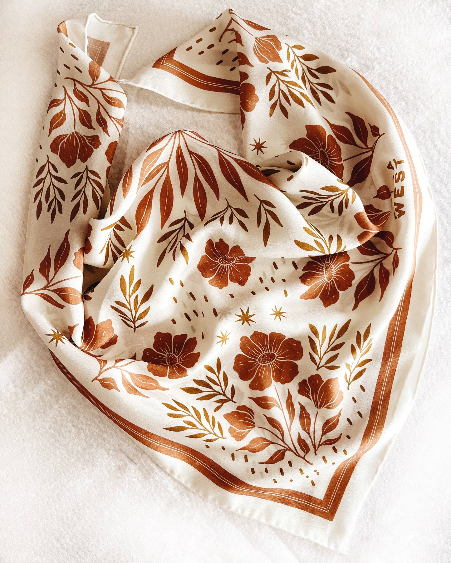 Silk scarf with white background and brown floral pattern