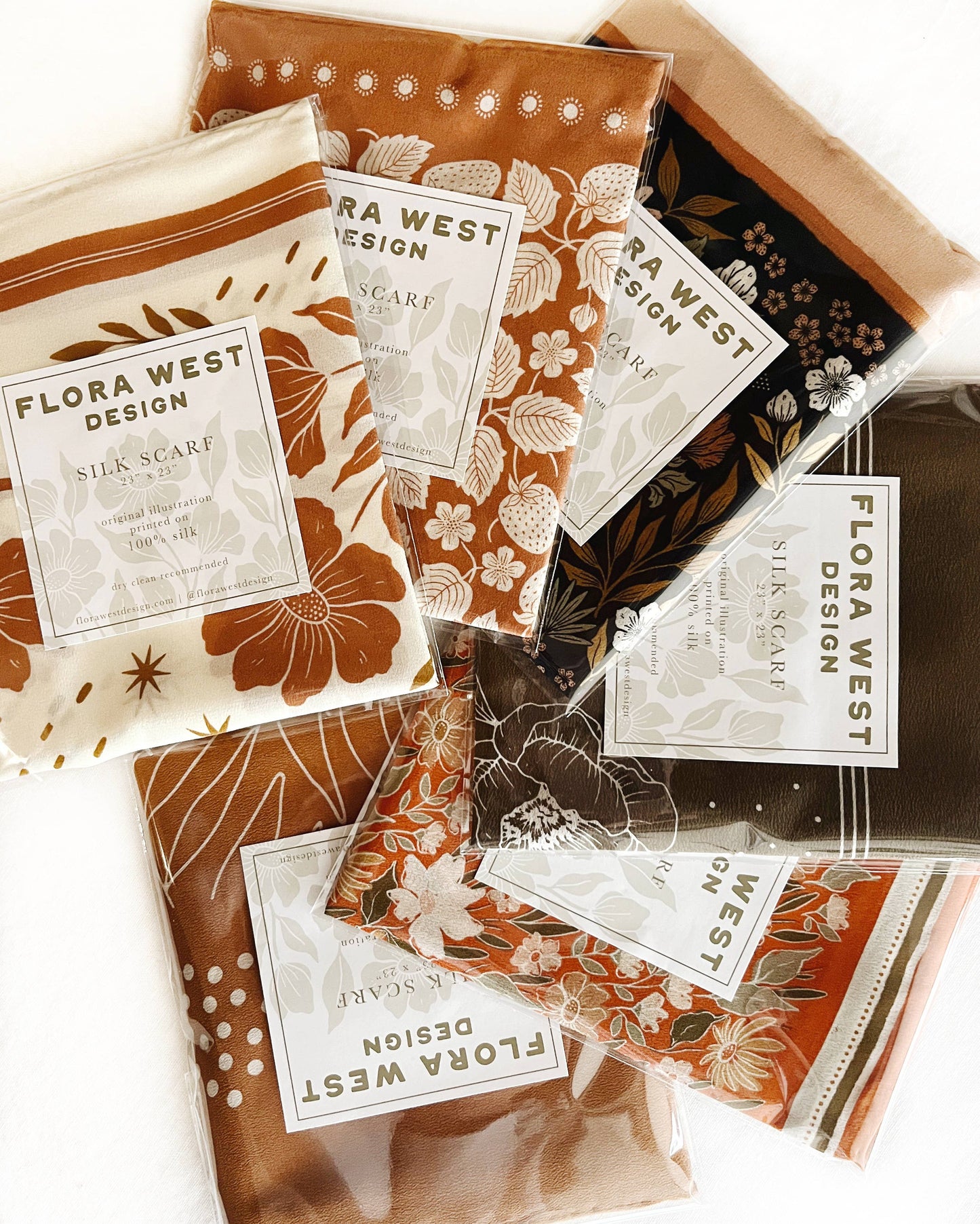 Packages of several silk scarves in floral prints