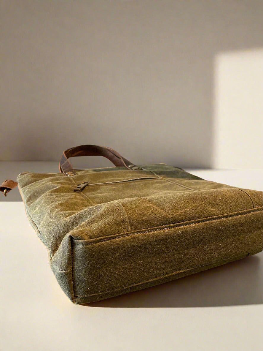Bottom view of a Crossbody/handbag, showing the flat base.