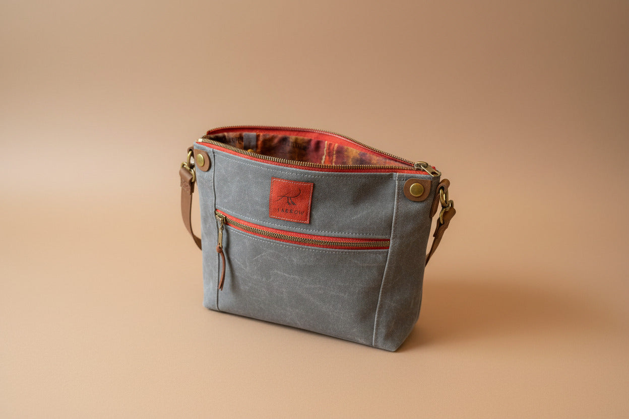 Inside view of Cambridge Petite in grey waxed canvas, showing a patterned lining.