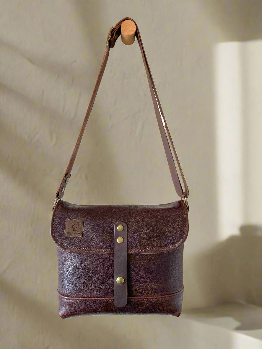 Handmade fully lined brown pebbled leather messenger bag with adjustable 1.5 inch strap. 