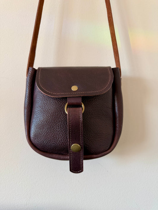 Scout small leather crossbody bag with adjustable strap and snap closure