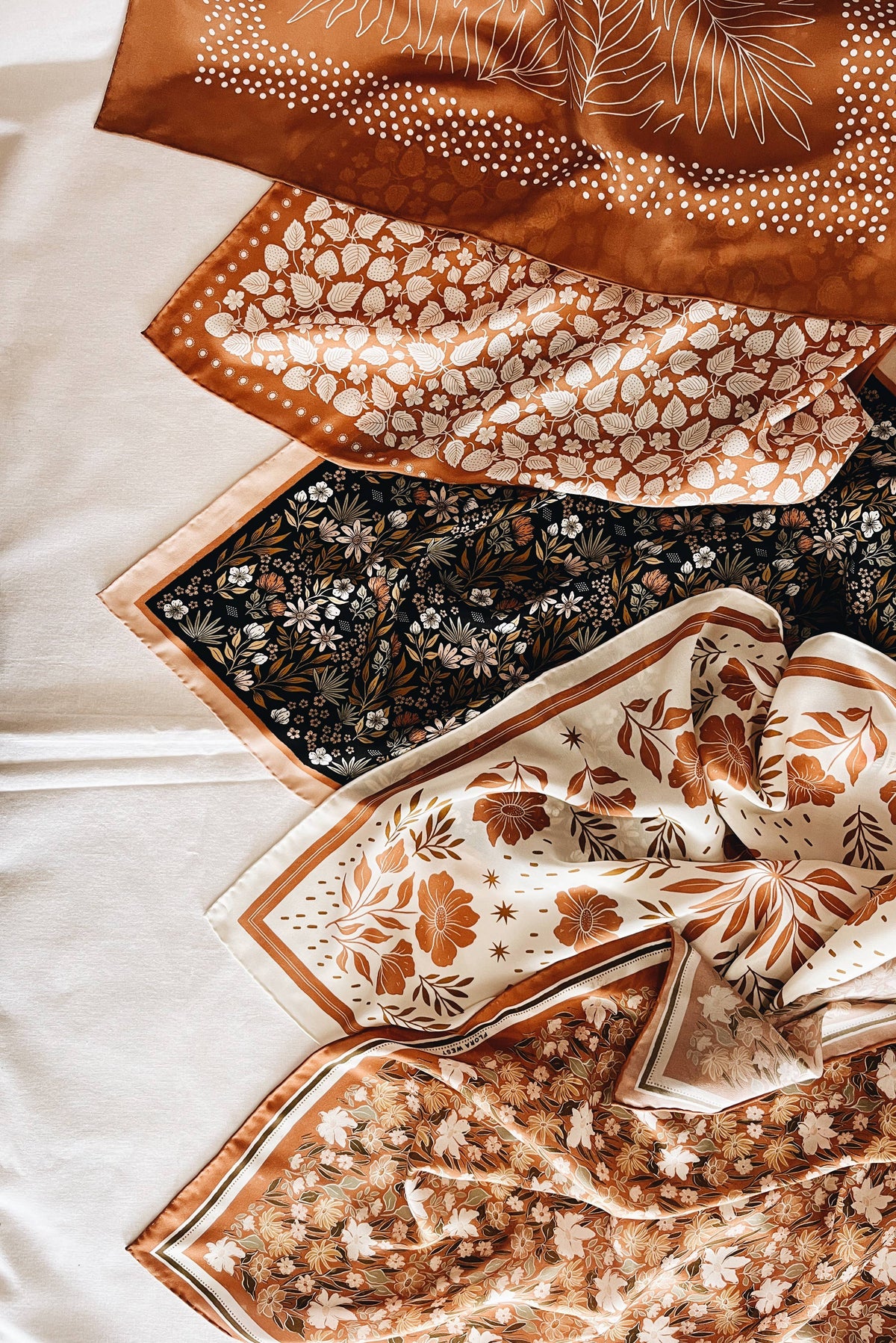5 bandana scarves in various floral earthy patterns
