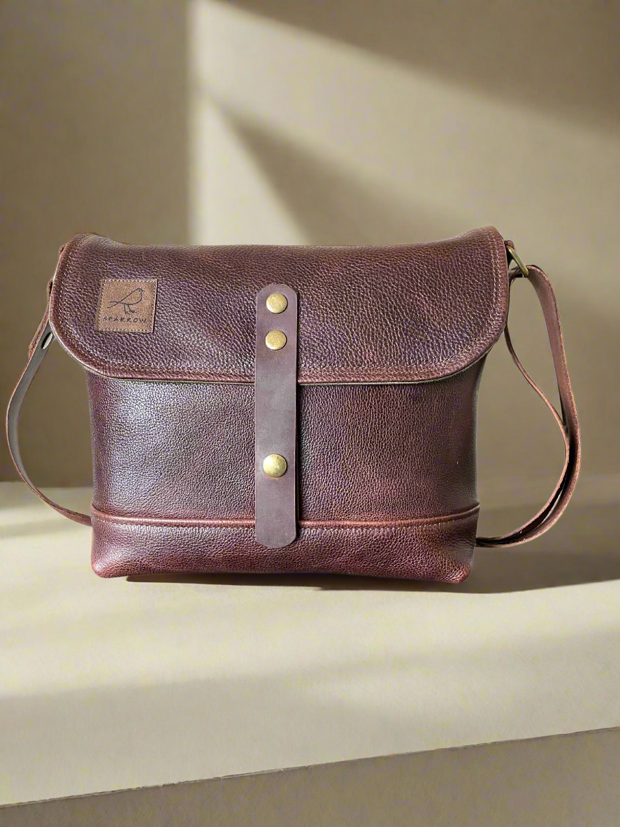 Handmade fully lined brown pebbled leather messenger bag with adjustable strap. 