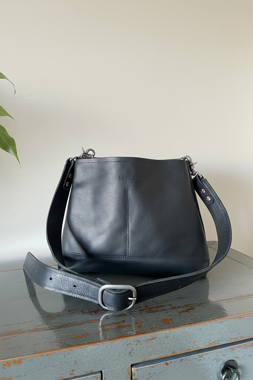 Sierra medium-sized black full-grain leather crossbody purse with adjustable strap and matte nickel hardware