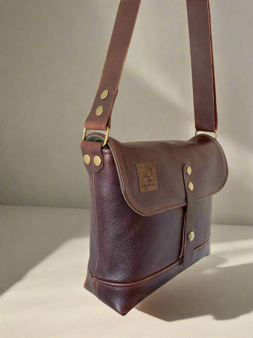 Handmade fully lined brown pebbled leather messenger bag with adjustable 1 1/2 wide strap. 