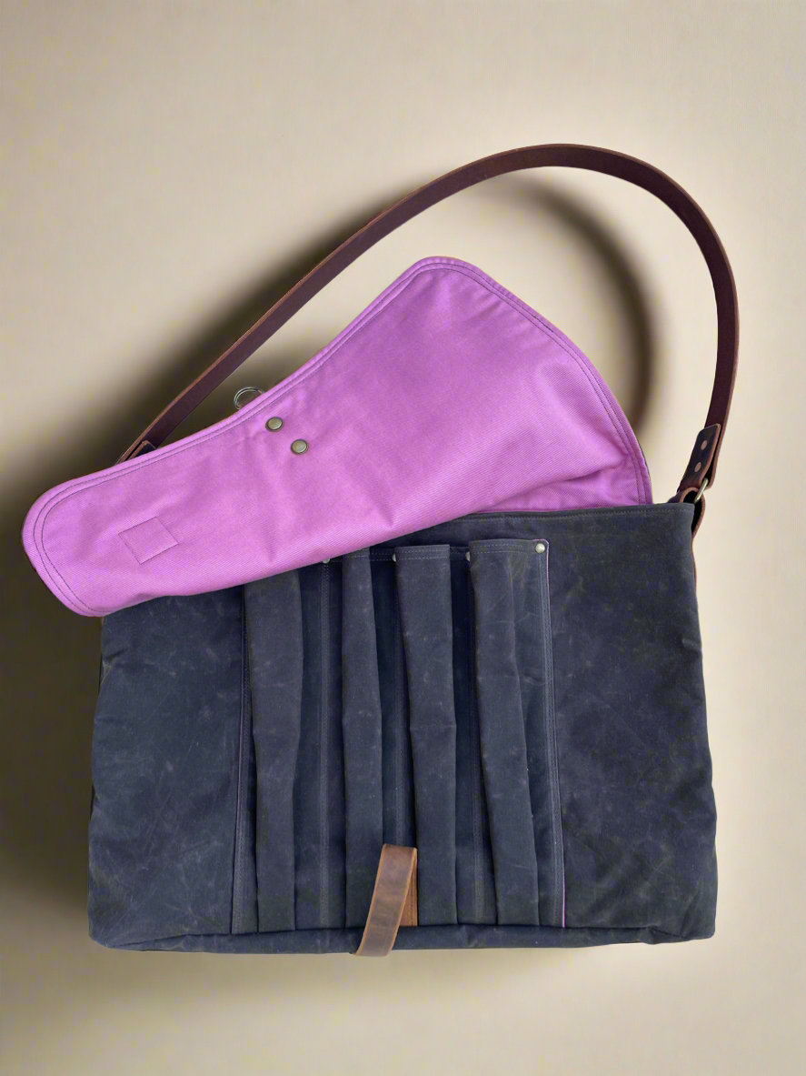 Waxed canvas crossbody specialty bag with 4 slip pockets for Attune Studio birthing stool. Pink lining, brown exterior.