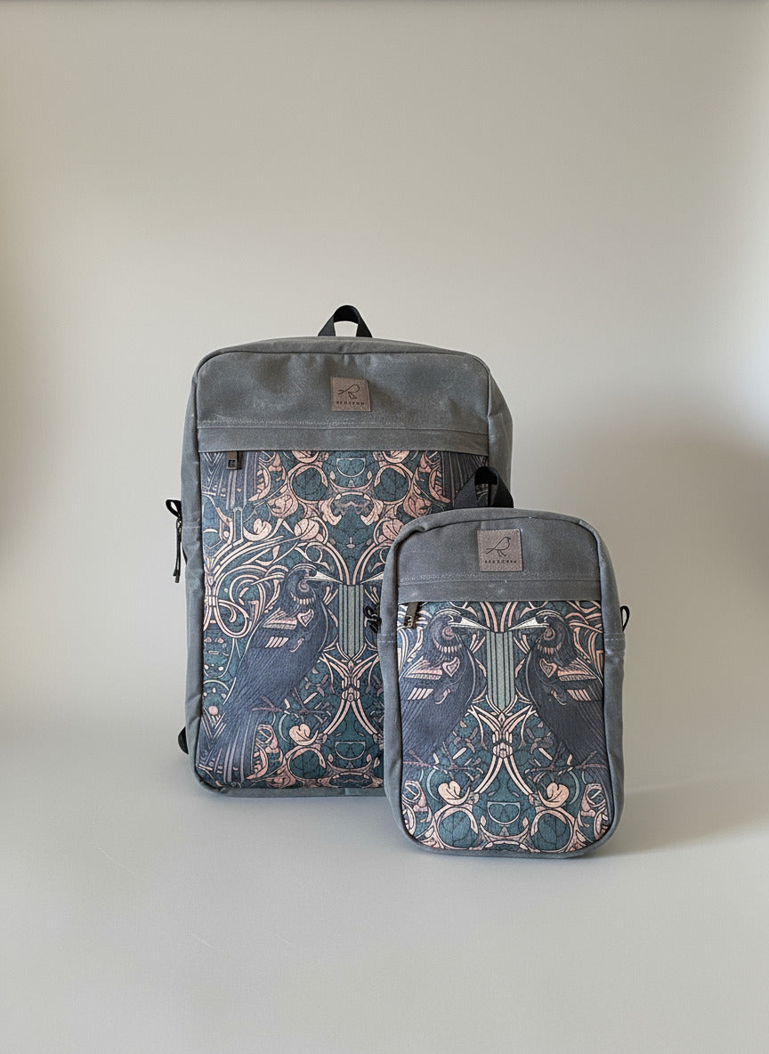 Waxed canvas sling bags in grey with raven or crow pattern on front