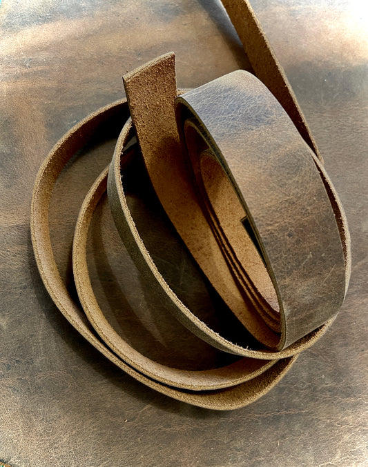 Warm brown leather straps, cut at 3/4 inch, 1 inch, and 1 1/2 inch widths, and cut at 3 different lengths. 5 - 6 oz full grain leather, raw edges, for use in bag making or crafting. 