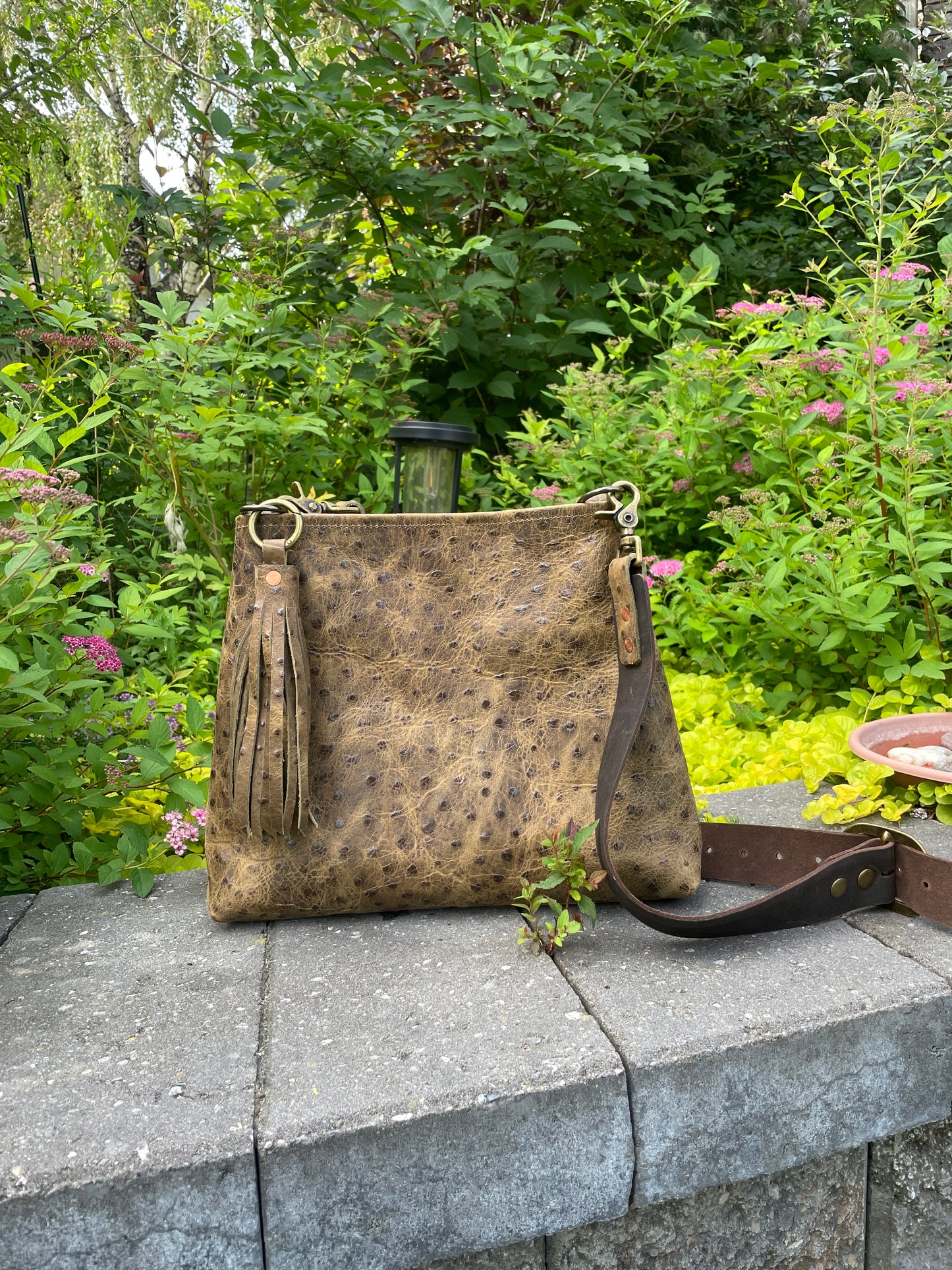 Sierra full-grain leather crossbody/shoulder bag in ostrich-embossed leather, with 1.5" wide adjustable leather strap. 
