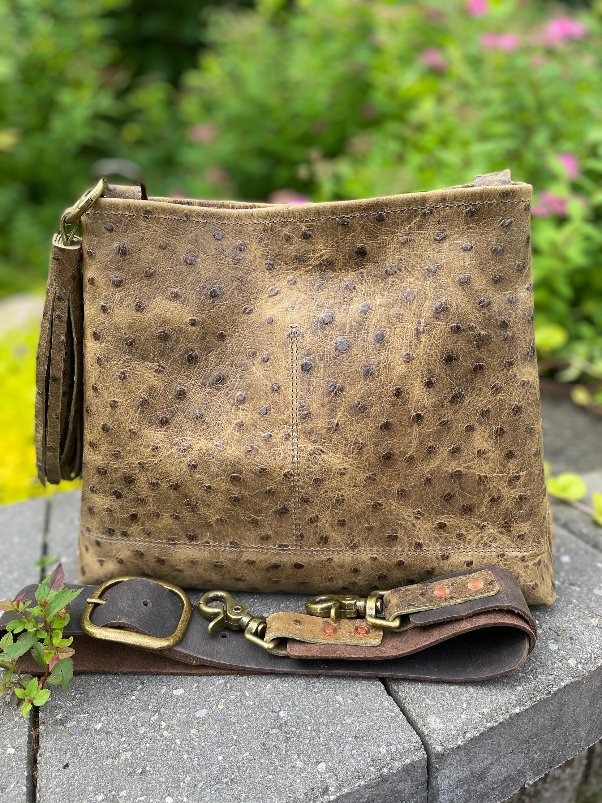 Sierra full-grain leather crossbody/shoulder bag in ostrich-embossed leather, with 1.5" wide adjustable leather strap. 