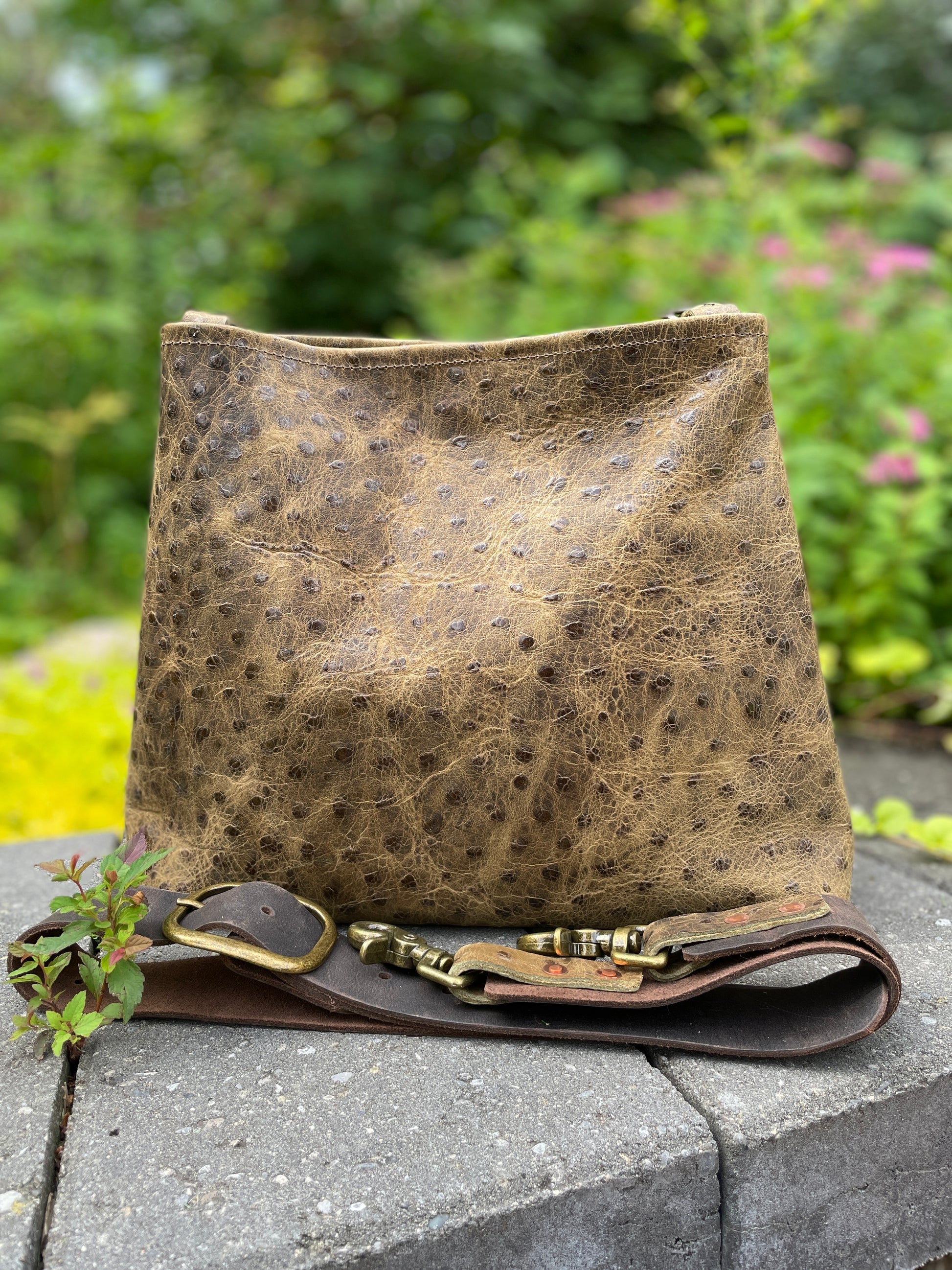 Sierra full-grain leather crossbody/shoulder bag in ostrich-embossed leather, with 1.5" wide adjustable leather strap. 