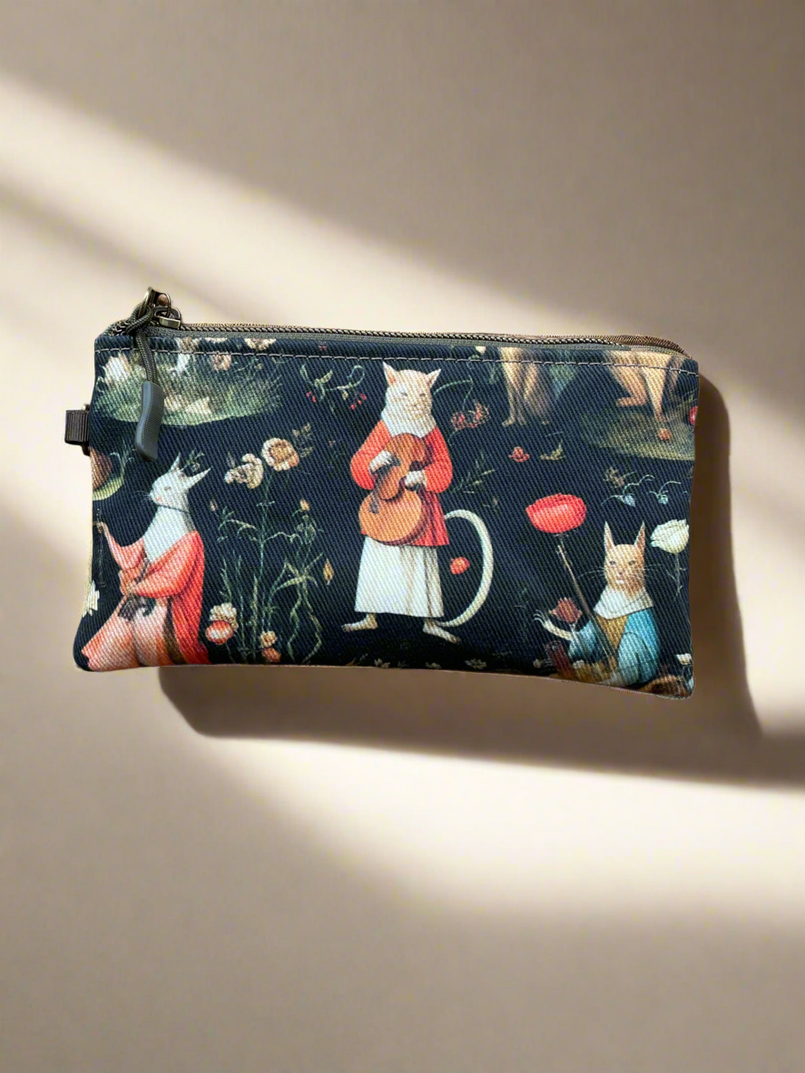 Zippered pouch with Hieronymous Bosch cats print on front.